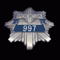 Zdjęcie przedstawiające policyjną odznakę z numerem 997