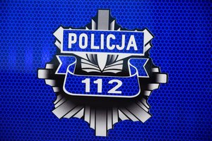 Logo policji na niebieskim tle