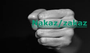 Zdjęcie ręki na ciemnym tle z napisem nakaz / zakaz