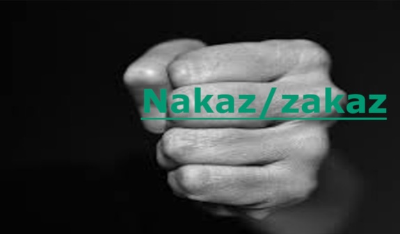 Zdjęcie ręki na ciemnym tle z napisem nakaz / zakaz
